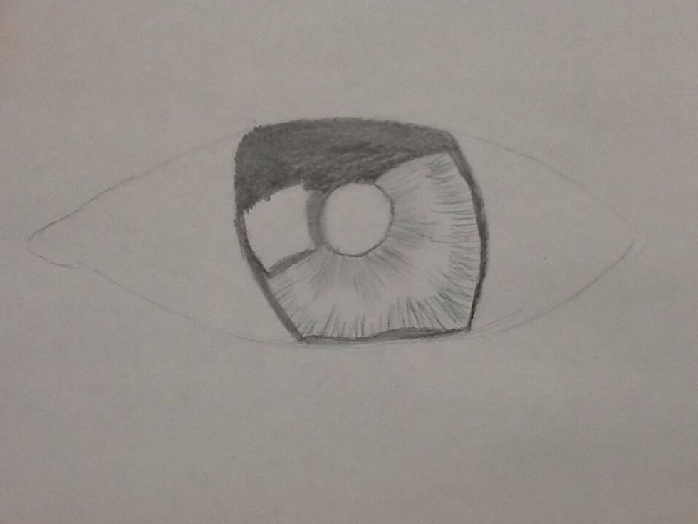 connecting to the pupil go out wards with your pencil and do the same to the edges of the inside Add shading anyway you want to make it look like an eye