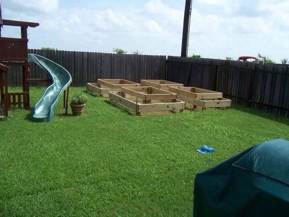 Construct garden boxes with the 2x10's on the bottom and the 2x8's on top. All corners should be reinforced with 4x4 posts. Design shown is based on 4x6 base boxes with extensions on three of them.