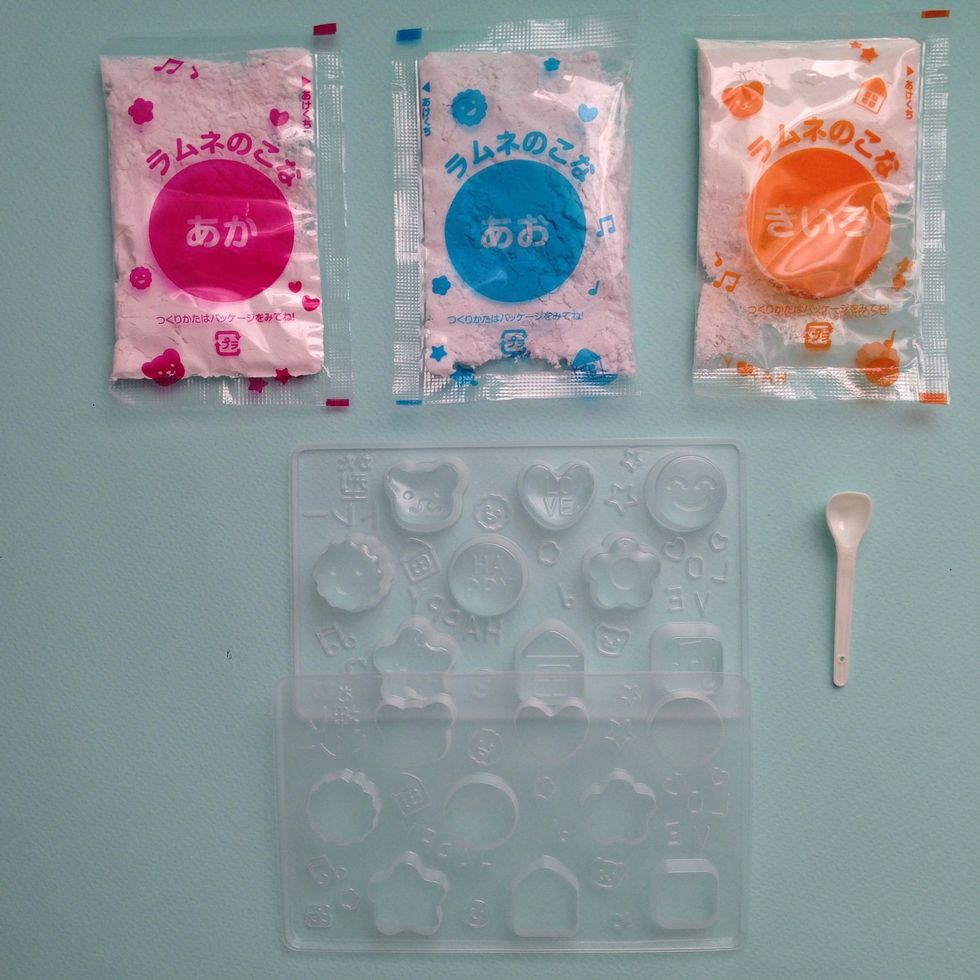 Contents: PINK-BLUE-ORANGE packets are all powder color mixes- orange actually makes Te color yellow- like the Primaries, Red, Blue, Yellow-- tablet Mold Forms and Measuring Spoon