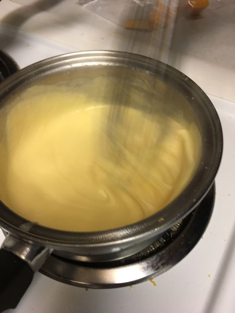 Continually whisk cheese mixture adding milk until thick