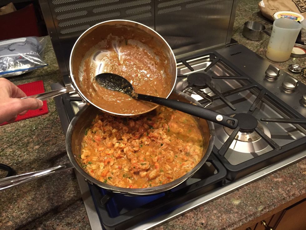 Continue adding the roux mixture incrementally to the crawfish/green onions