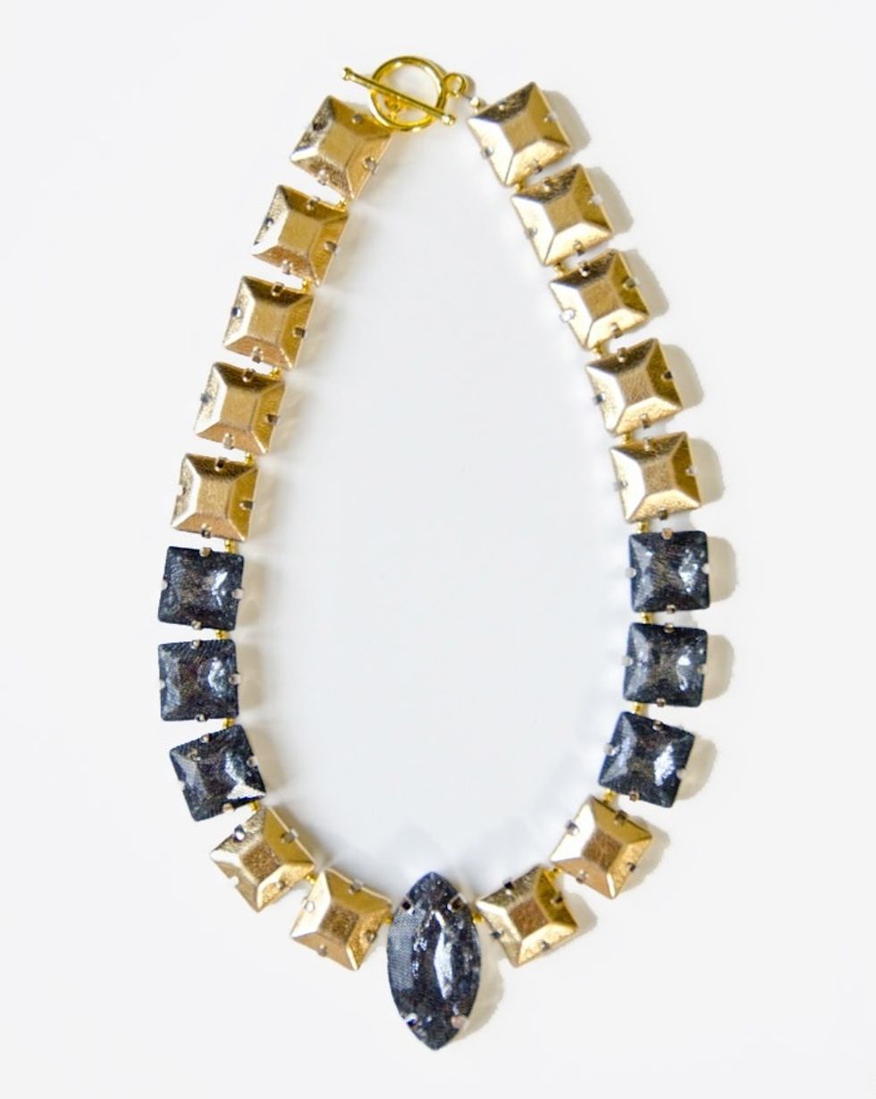 Continue adding your square rhinestones beads until you reach the center then add the oblong black bead. This will serve as your anchor, then continue out the other side repeating the pattern.