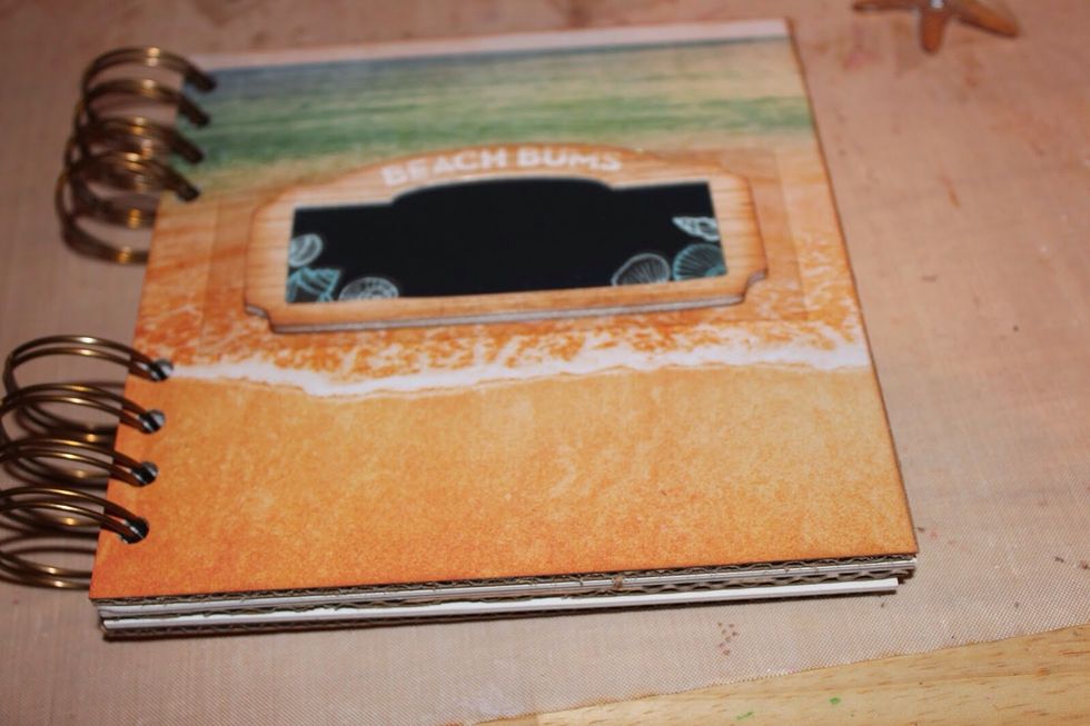 Continue applying vintage photo ink to all 3-D elements using foam brush and adhere to mini album.