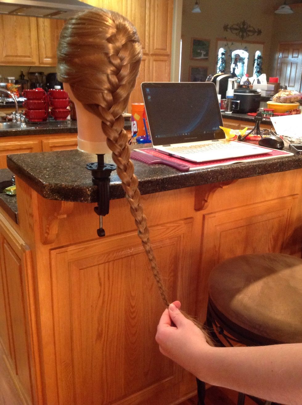 Continue braiding all the way down the hair.