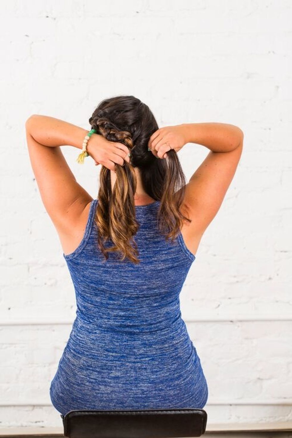 Continue braiding behind you hair, making sure to incorporate each additional curl.