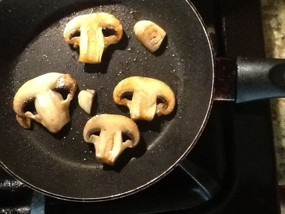 Continue cooking mushrooms; stir them every few minutes so they don't burn.