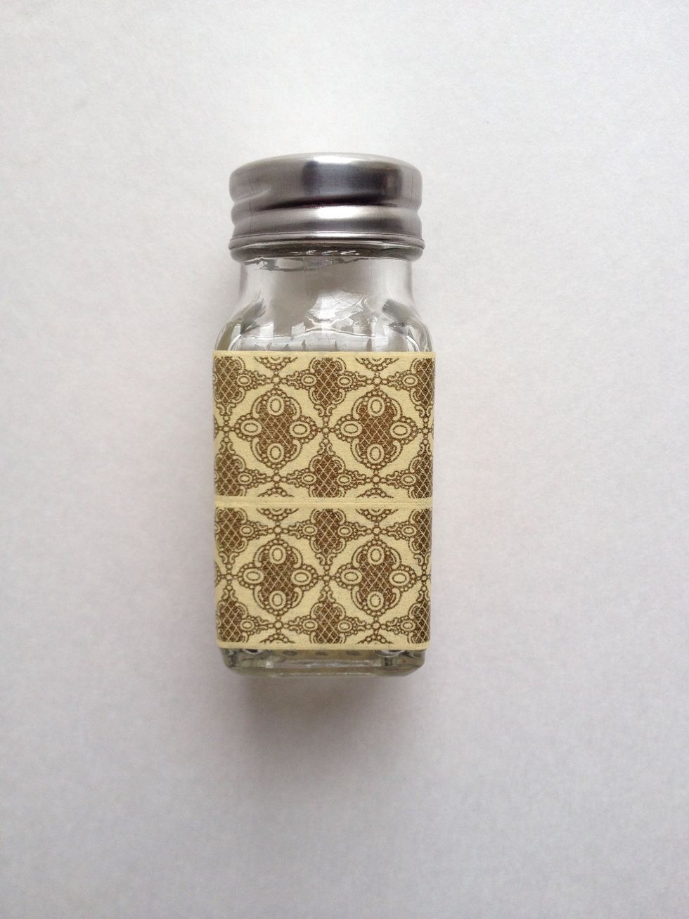 Continue covering your shaker until it is covered by washi tape. Trim. Again, feel free to apply glue or other adhesive behind the washi tape before attaching for extra hold.