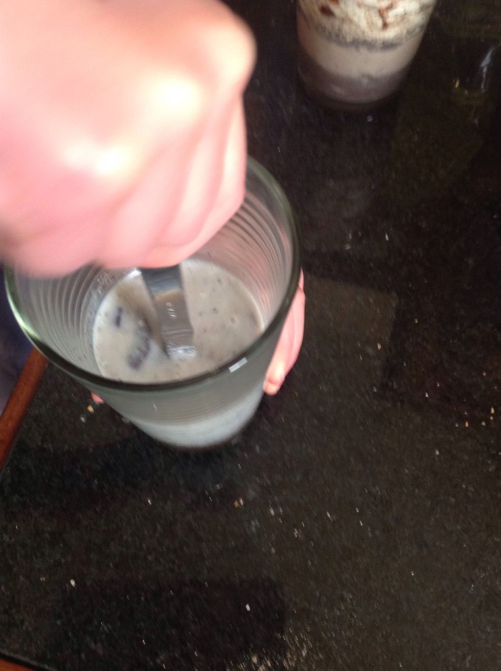 Continue crushing the Oreos with a spoon until there isn't many lumps left in the glass.