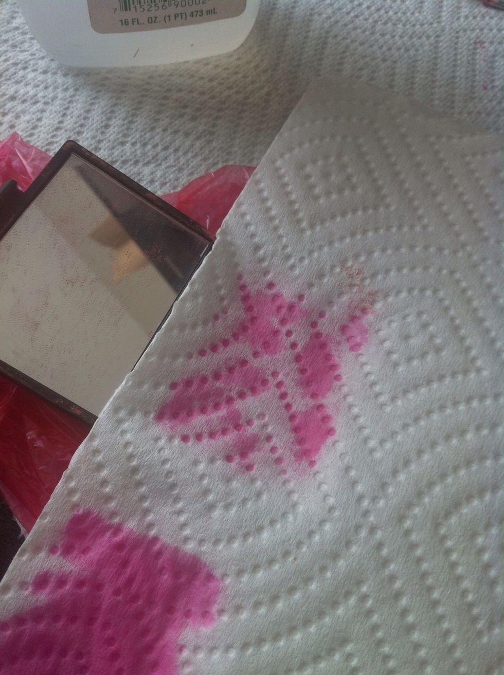 Continue dabbing until less and less alcohol comes through.