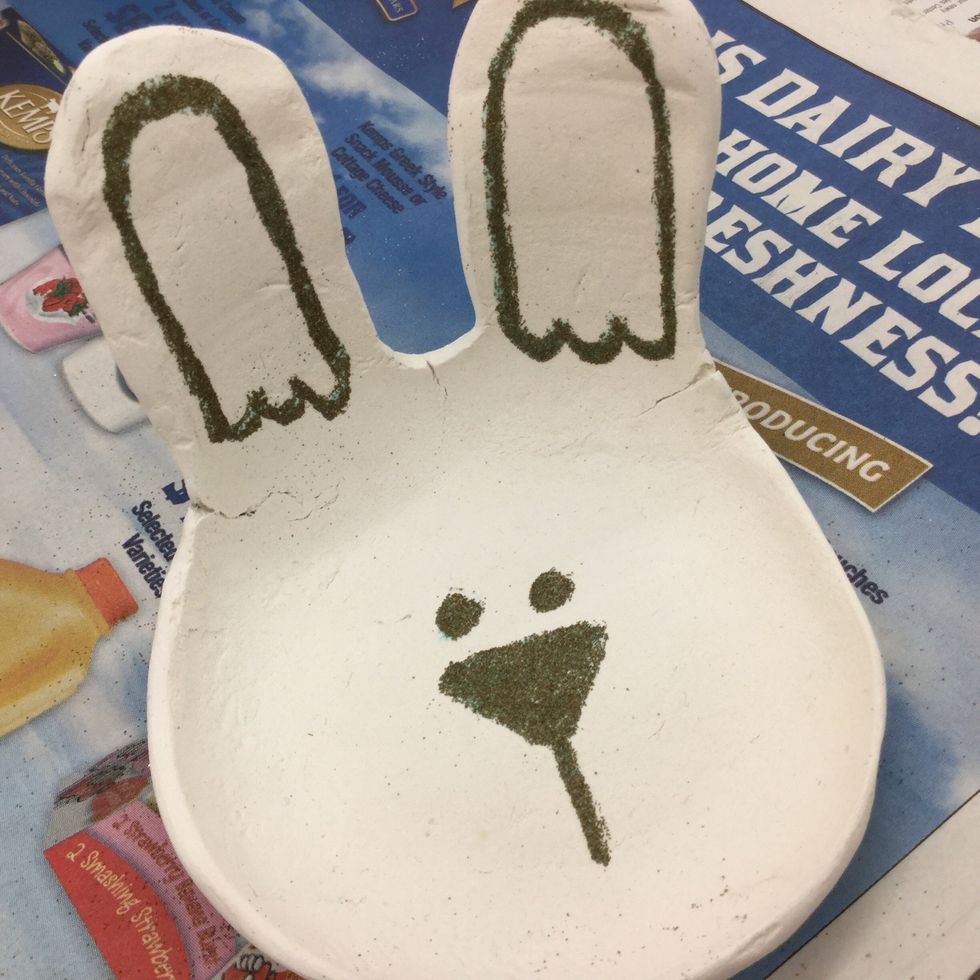 Continue drawing features and adding embossing powder one item at a time until you are satisfied with the bunny's face.