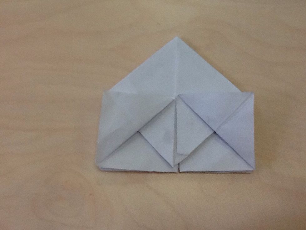 Continue, fold the open side of the square in both side.