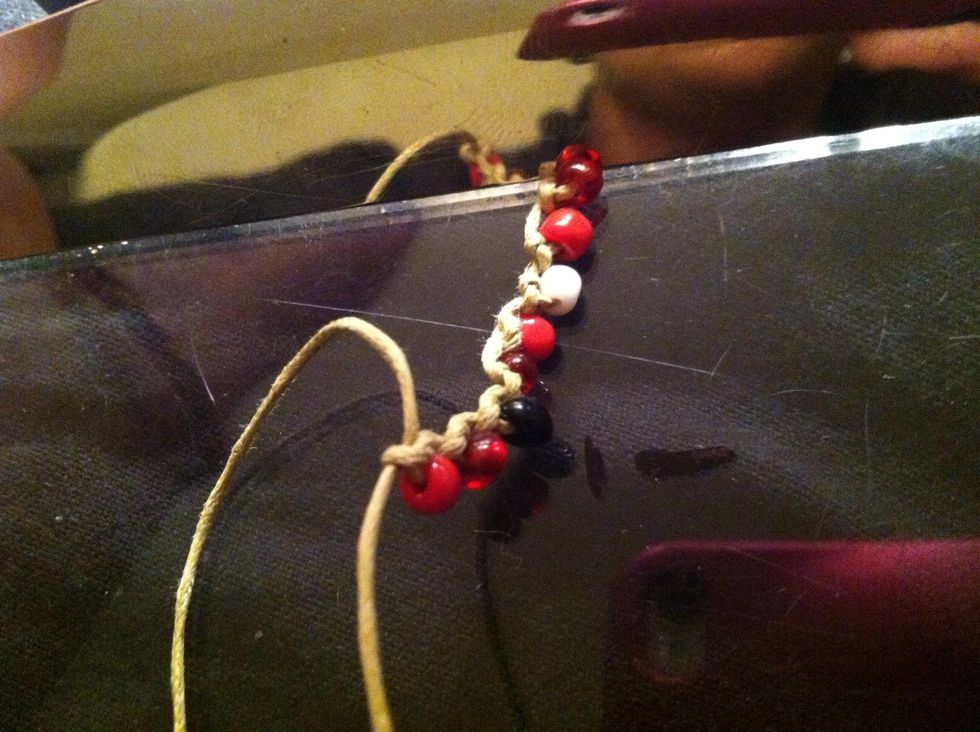 Continue for about 10 beads. If you're doing it correctly it will start to curl. This means you are pulling tight enough. This is good but kinda ugly... Let's fix it!