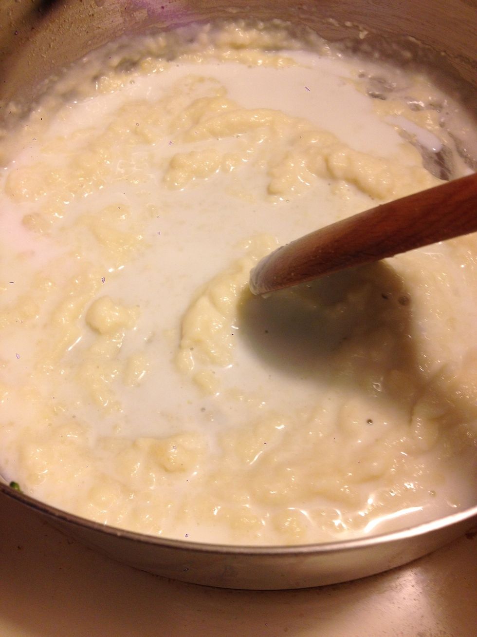 Continue gradually adding milk, stirring out lumps as you go
