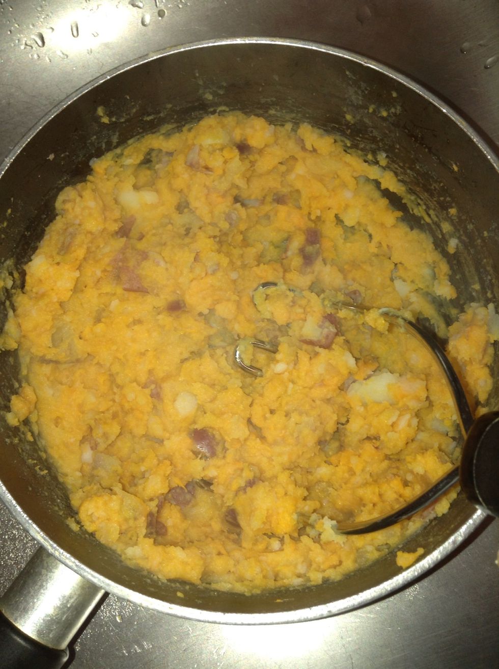 Continue mashing the potatoes