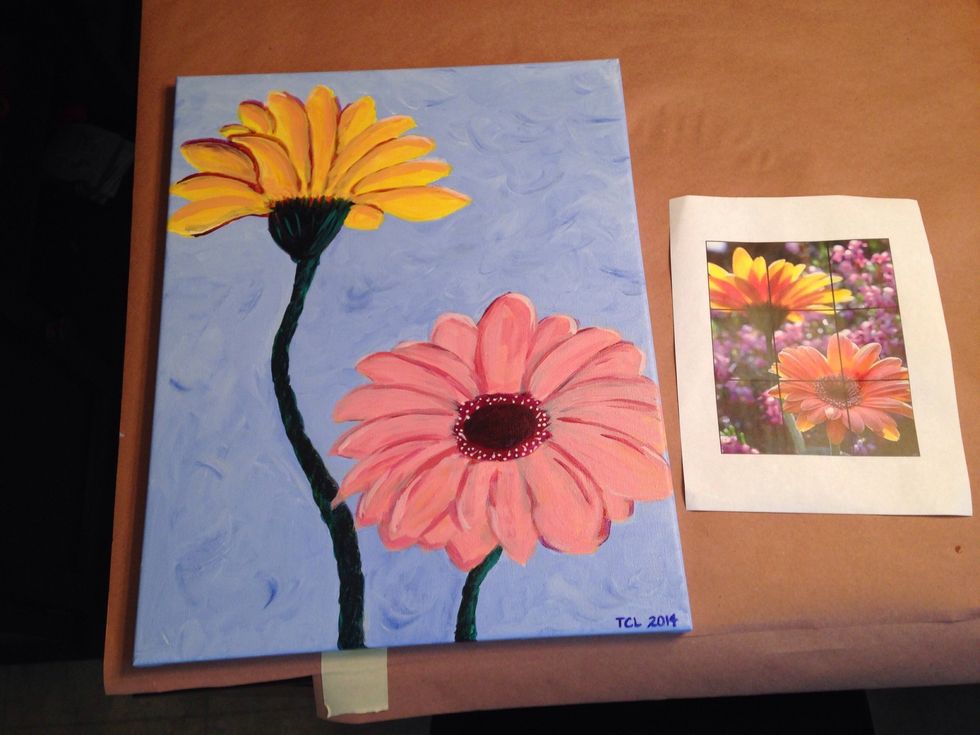 Continue mixing colors, painting over sections w/yellow, red, and white. Paint white dots in center of flower with fine tipped paintbrush. Remember to sign your artwork! You're a pro!