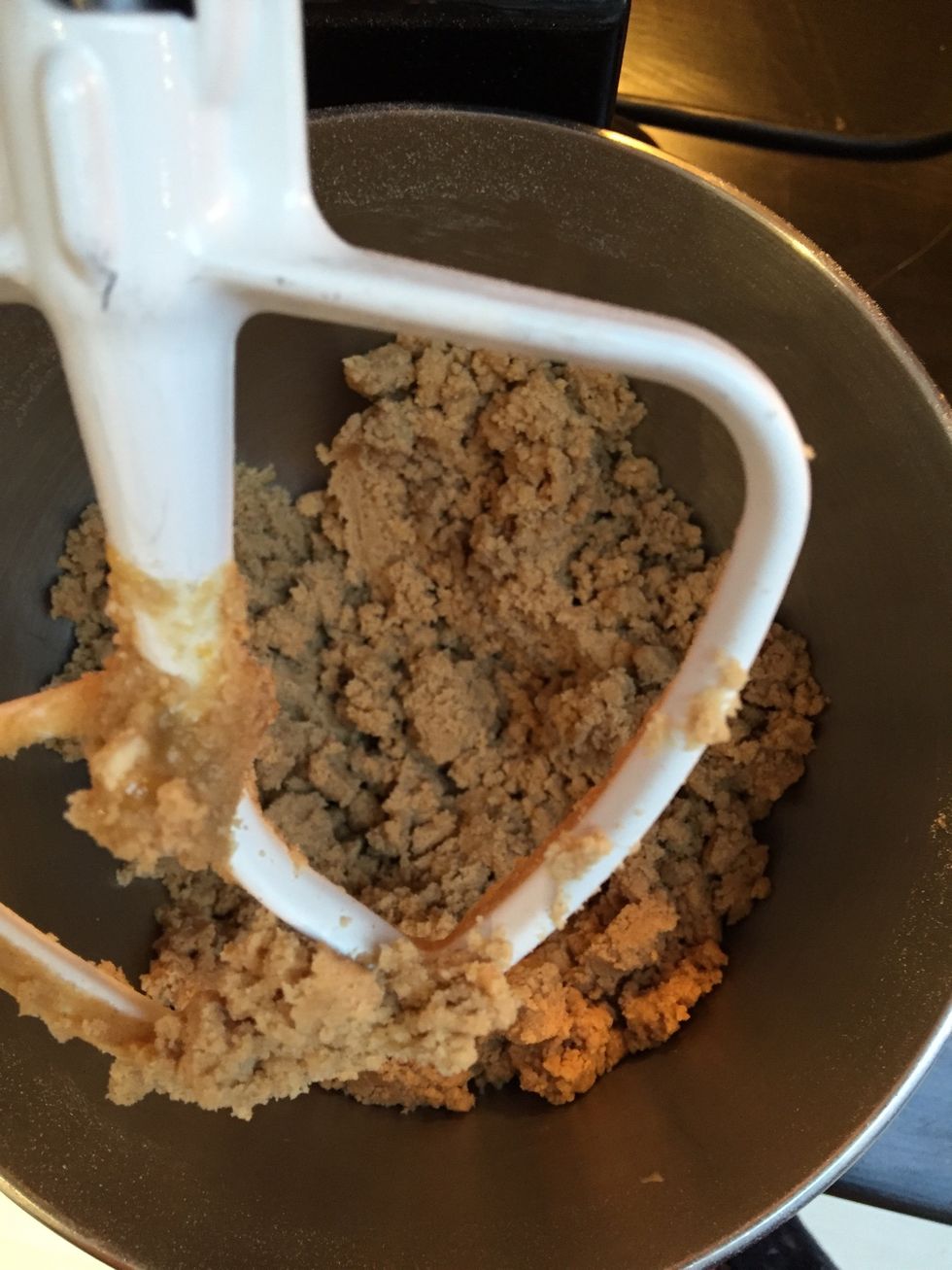 Continue mixing until the dough starts to come together