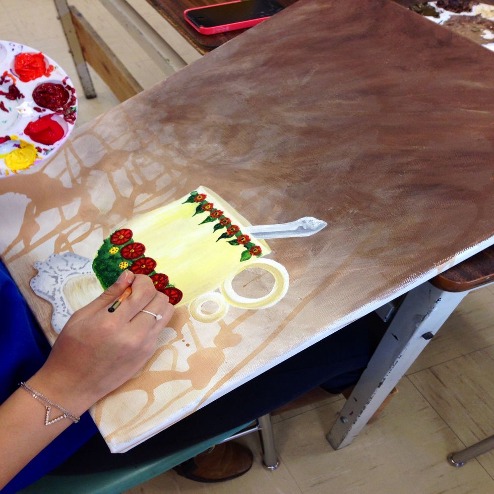 Continue painting flowers and allow to dry.  Add dark grey to the outer portion of the spoon to create a shadow.