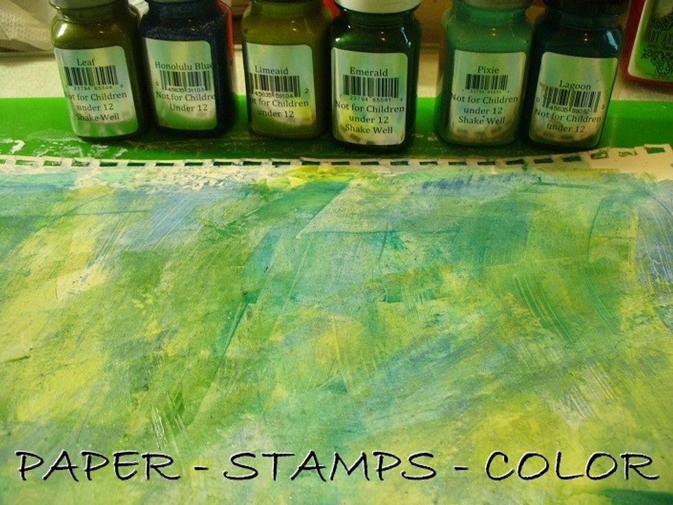 Continue scraping on Pixie Sorbet, Lagoon Velvet and Emerald gemstones. As I planned to continue with orange and red, I dried the page first before continuing.