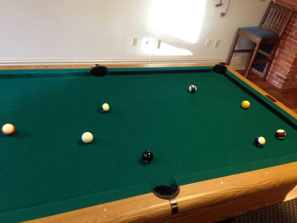 Continue sinking the balls that you have claimed (solids in this case) until only the 8-ball is left.