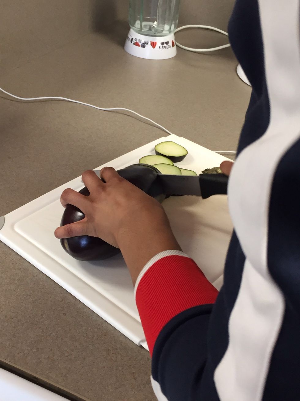 Continue slicing the eggplant