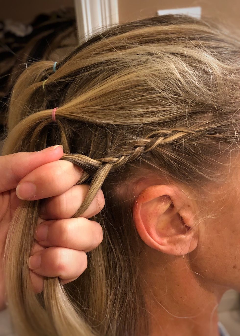 Continue steps 6-9 until you reach a point where there is no more hair left in the section to add into the braid.