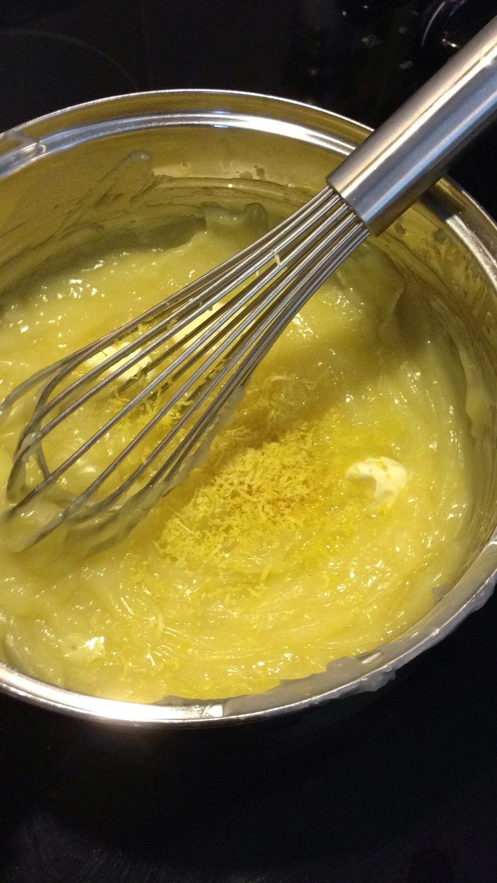 Continue stirring. Add in 2 tablespoon of butter, your lemon zest, and 1/3 cup of lemon juice. Continue to cook for 4 mins.