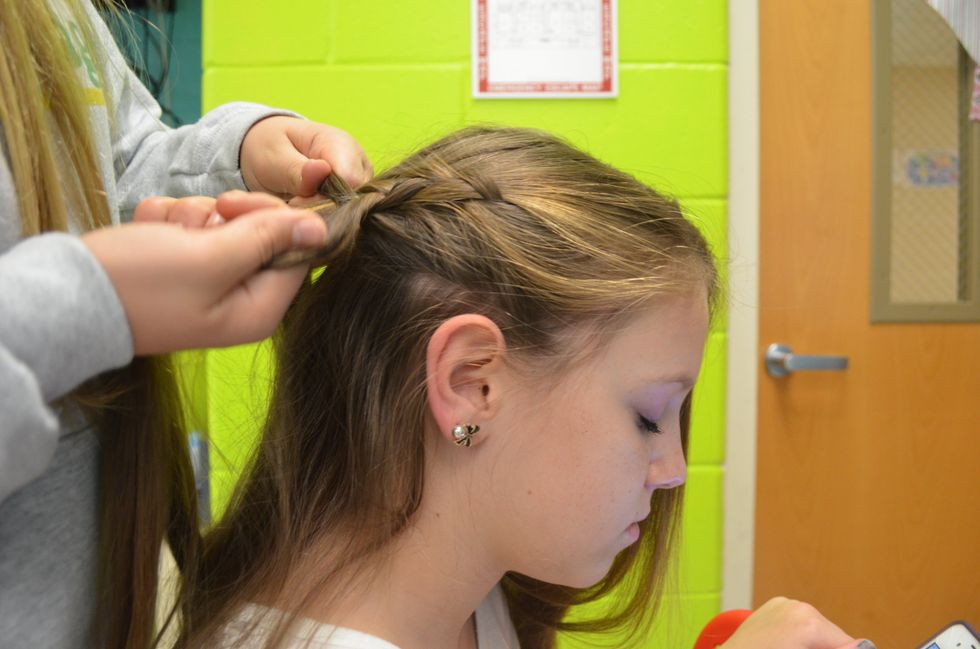 Continue the braid and start to curve downward.