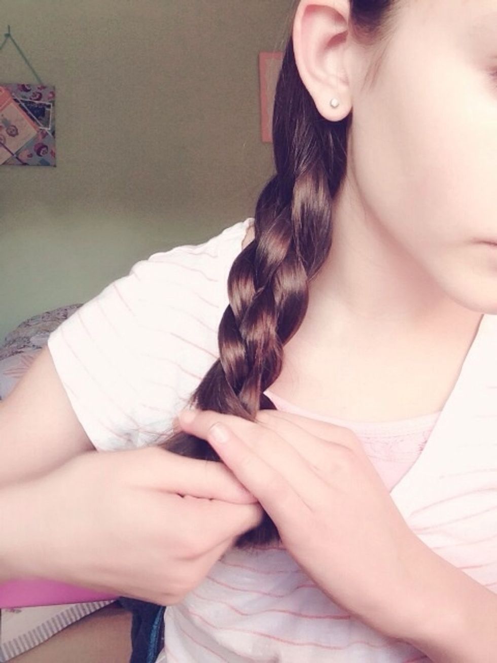 Continue the steps all the way down your hair and tie with an elastic