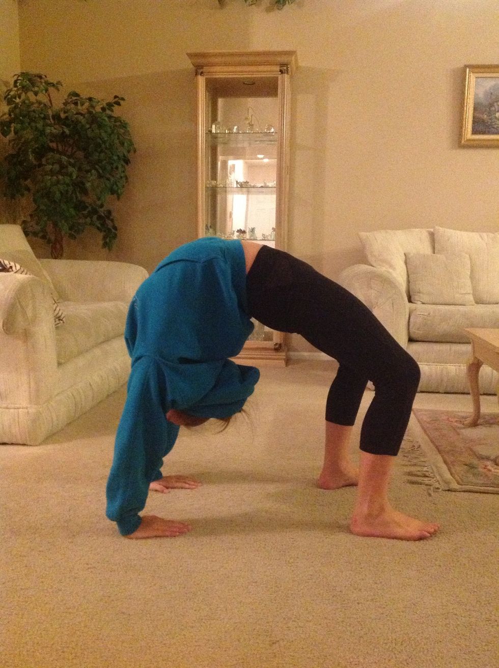 Continue the walkover until you plant your feet in a backbend position.