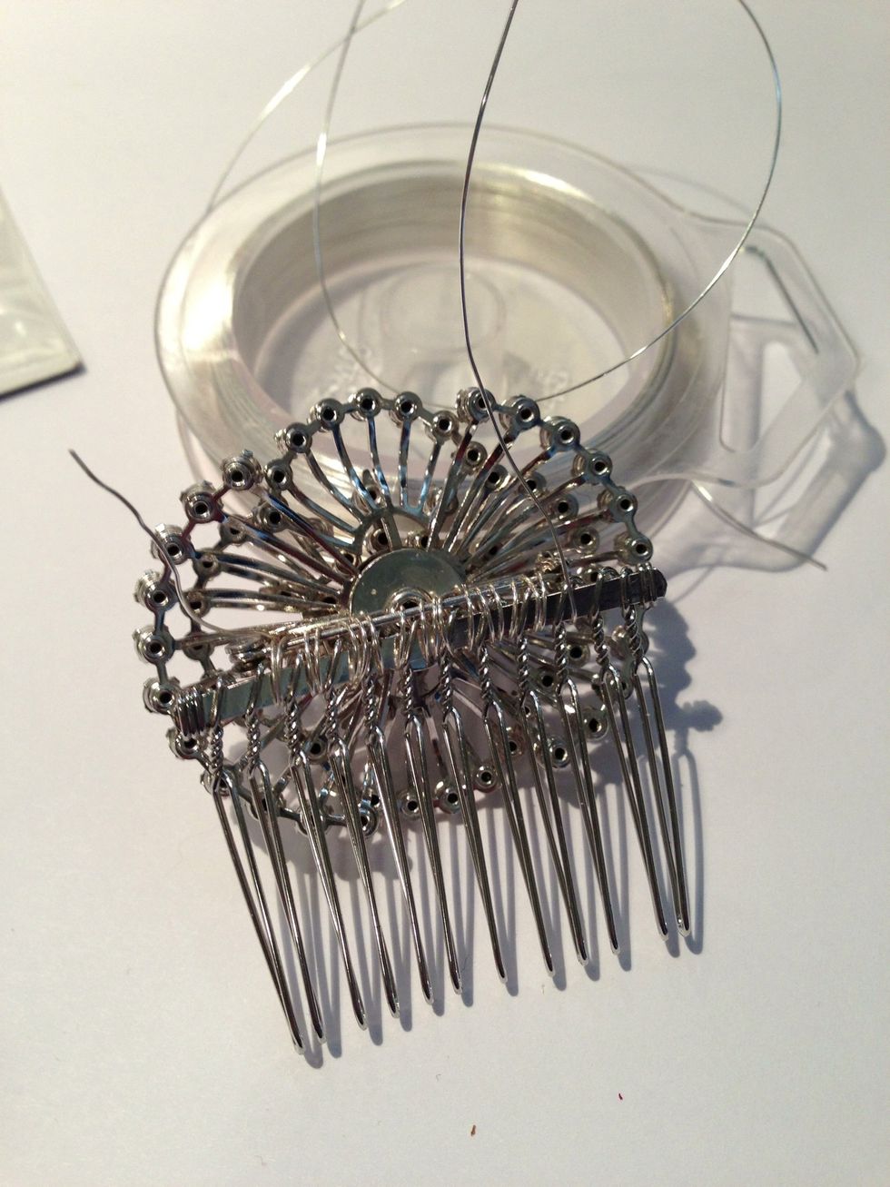 Continue threading all the way down the length of the comb, taking care to pull & tighten each loop as you go.