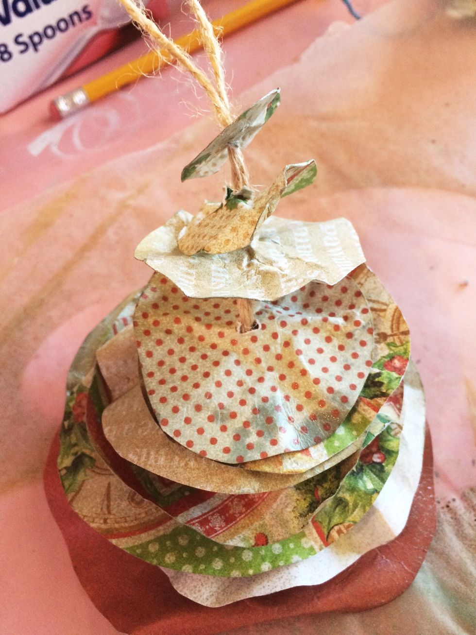 Continue threading your circles from largest to smallest. When all are on, you can "fluff" your tree to the fullness you desire. The texture in your rope will hold your layers in place!