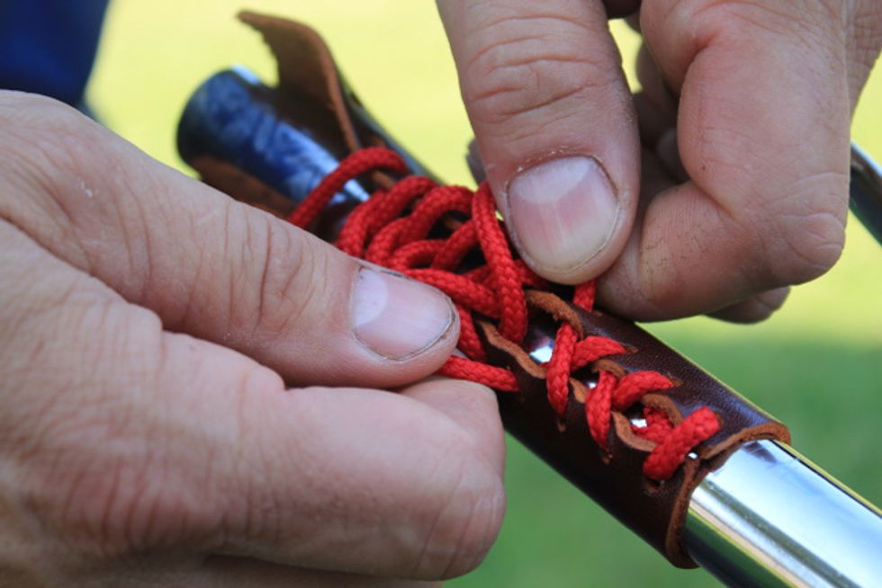 Continue tightening the laces until 2/3 of the grip's lace is tight.
