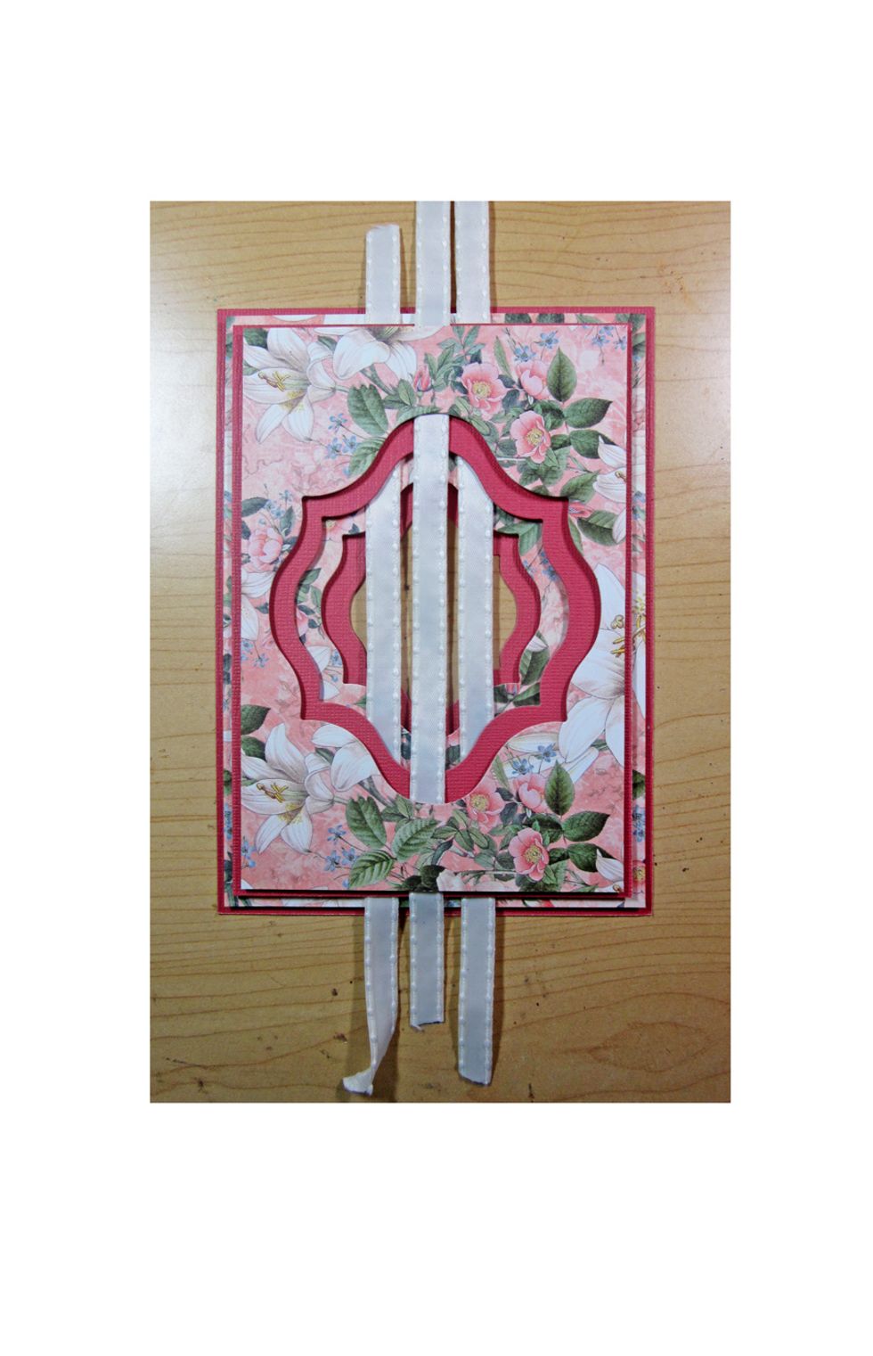 Continue to add two more strips of ribbon as shown. Be sure to alternate the layer that you are running under.