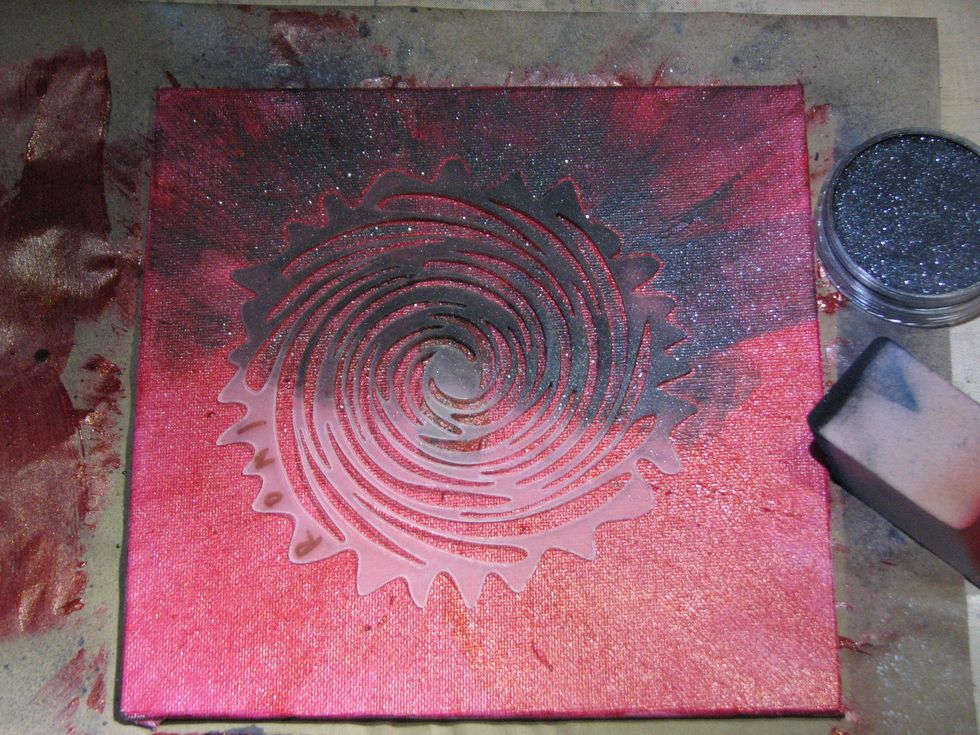Continue to apply the PanPastels from the center outward so it looks like it is radiating from the eyes as well.