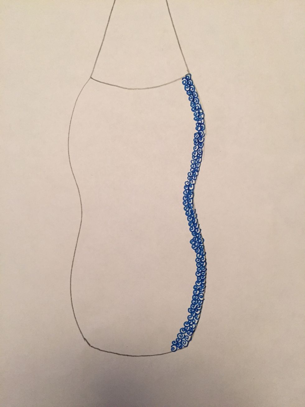 Continue to create dark value along the right side with small close shapes or symbols.