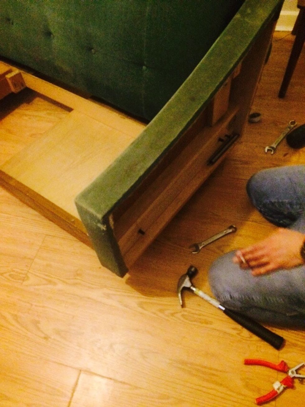 Continue to disassemble - we are removing the arms from the sofa bed mechanism. It was hard work watching my partner struggle to remove the nut. Lol