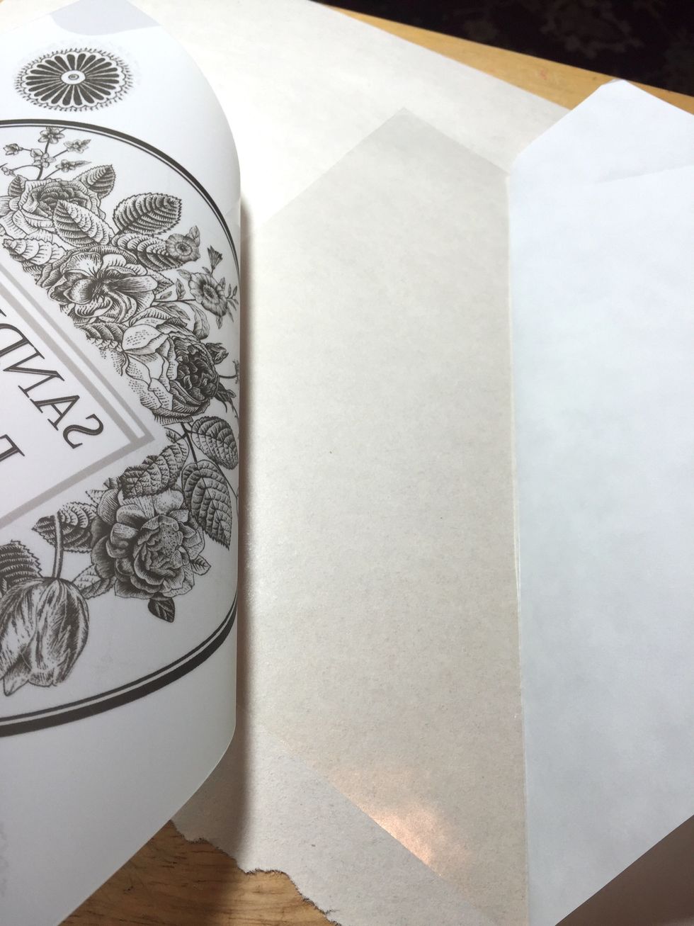 continue to peel back the liner and apply the transfer sheet, smoothing out air bubbles as you go.