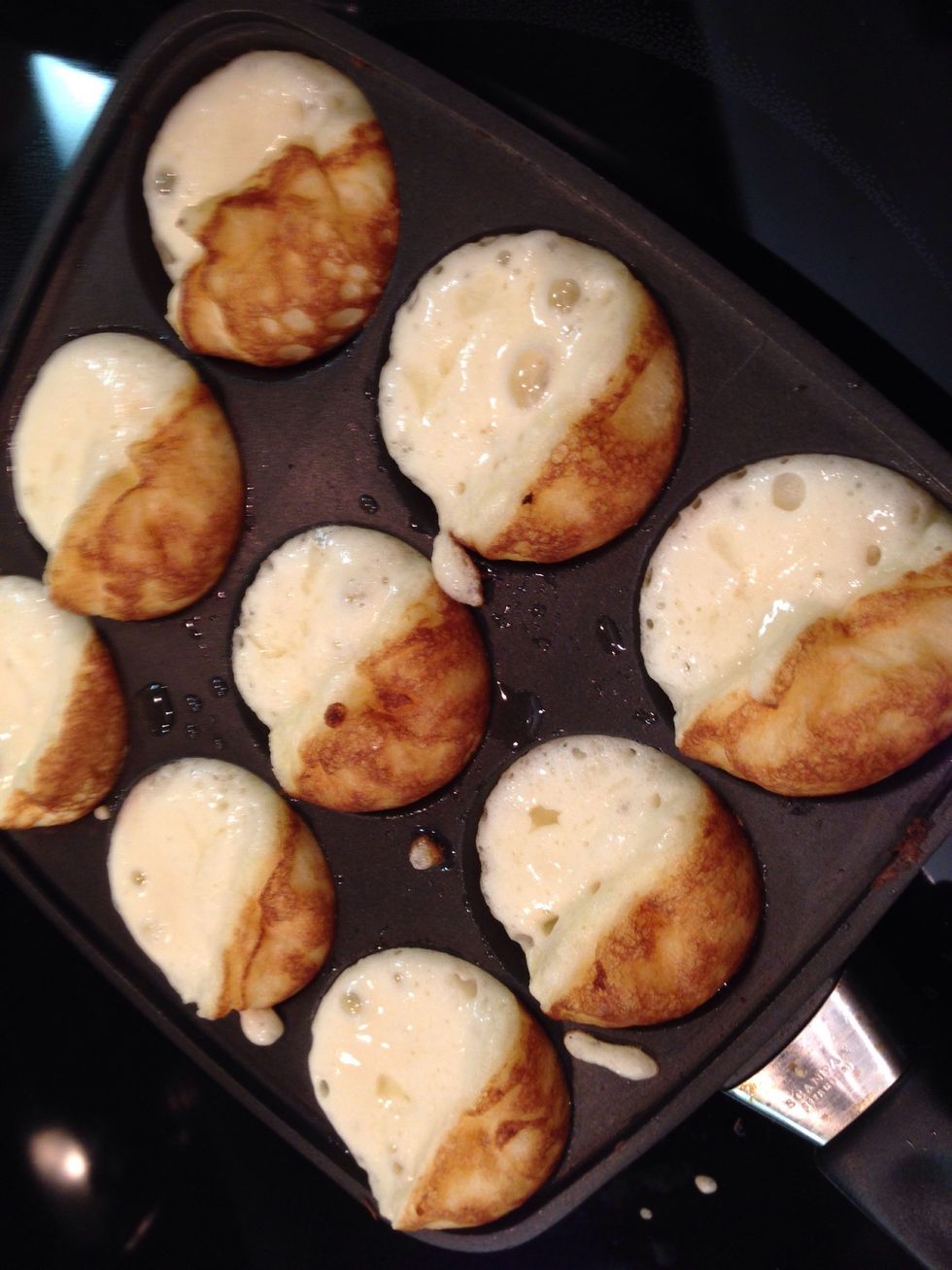 Continue to rotate the Aebleskivers. Letting them get golden brown.