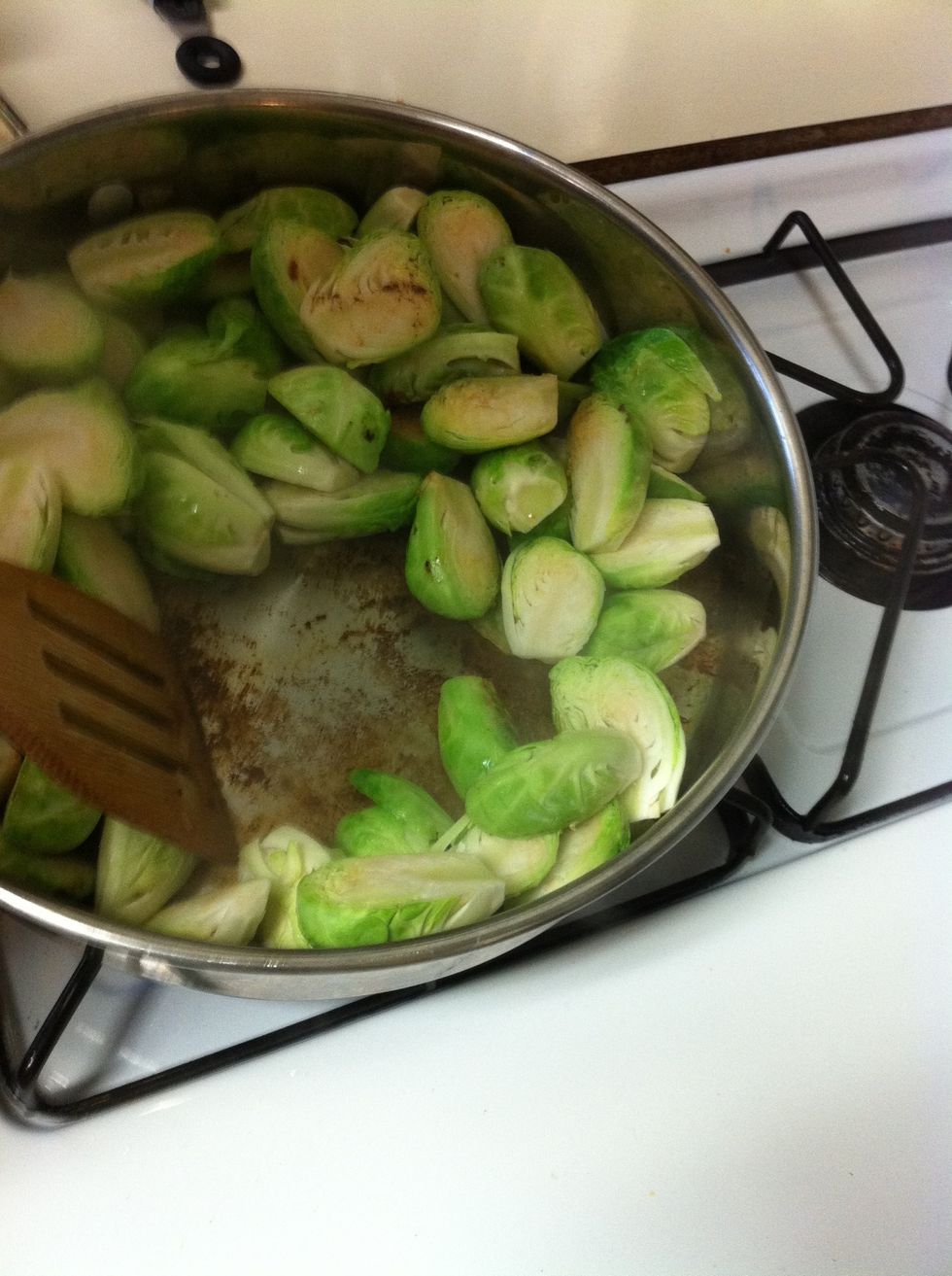Continue to saut\u00e9 the brussels sprouts adding in the rest of the chicken broth once the original amount reduces away. Make sure you've scraped up all the fond on the bottom of the pan. Cover again