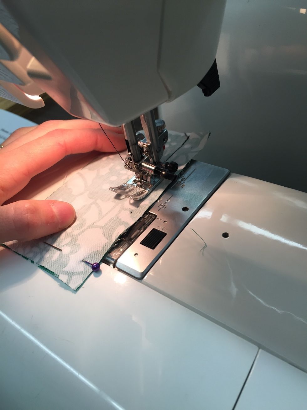 Continue to sew FORWARD to the end of the fabric, making sure to stop and remove each pin as you go. DO NOT SEW OVER TOP OF PINS!