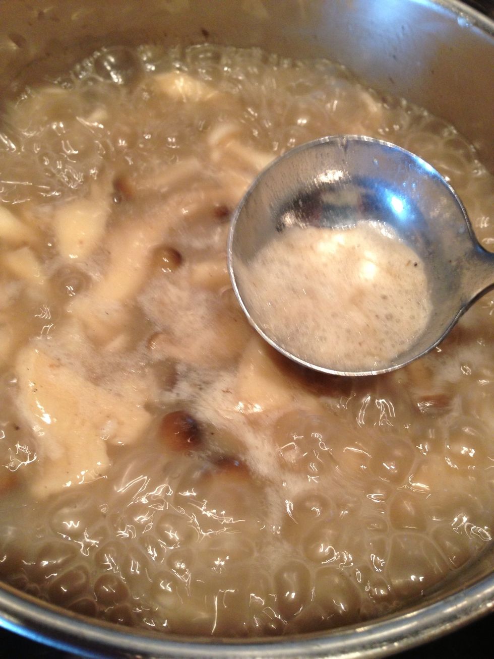 Continue to simmer until the broth thicken like porridge. Add salt, pepper, and fish sauce in it. Remember to pick up the scum.