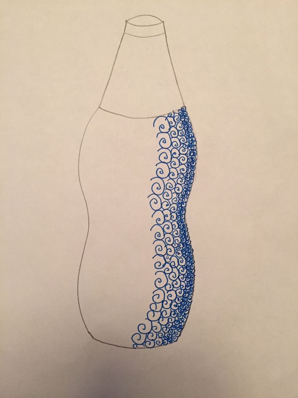 Continue to slowly draw your shapes or symbols bigger and bigger towards the center of your bottle.