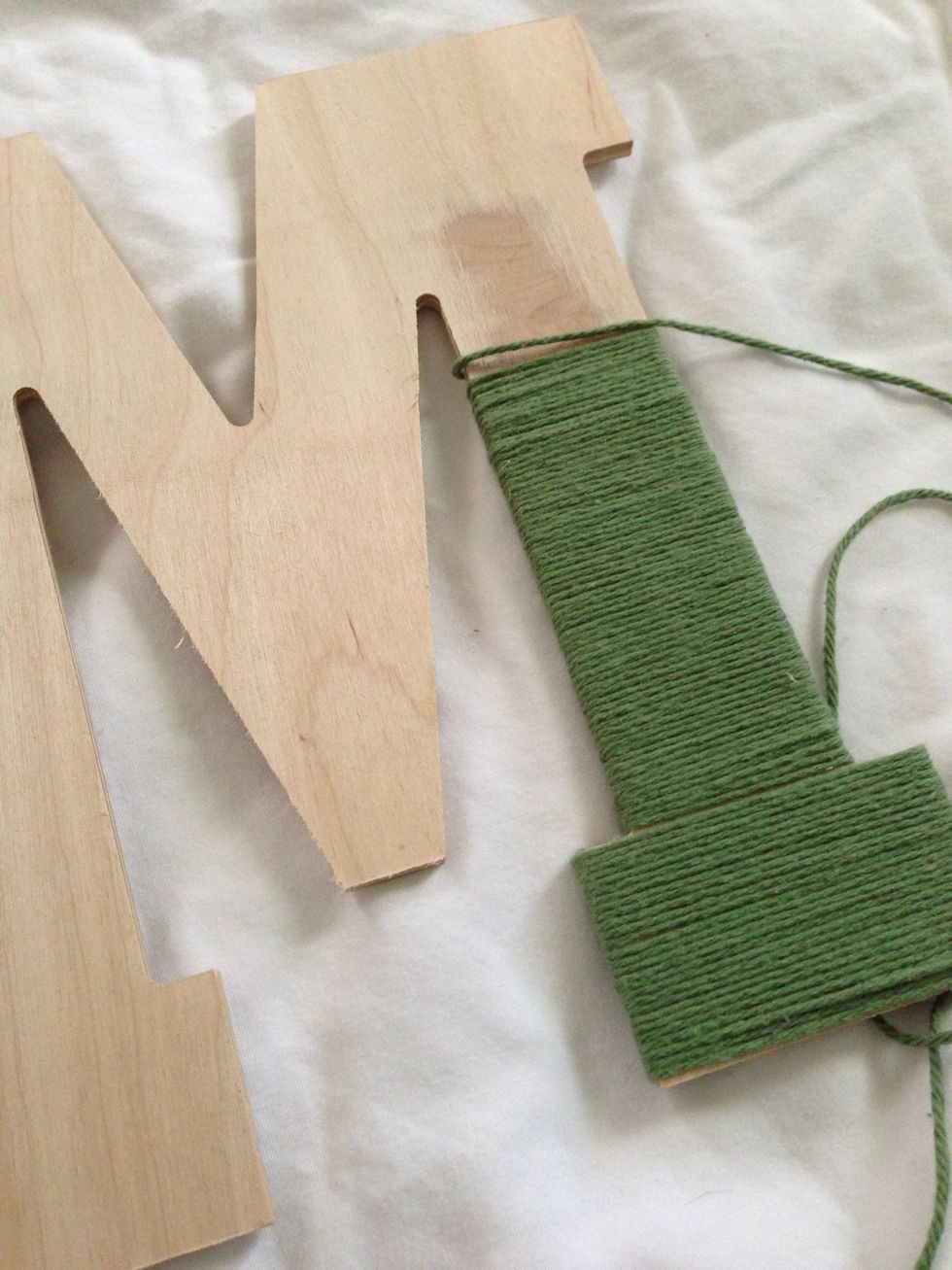 Continue to wrap the letter with the yarn. If you have to cut the yarn at any point secure it with a glue dot or drop of hot glue.