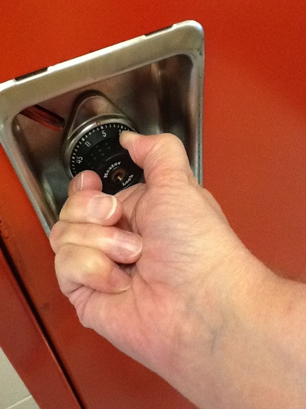 Continue turning to the right past your last number.  You should hear some clicking noises.