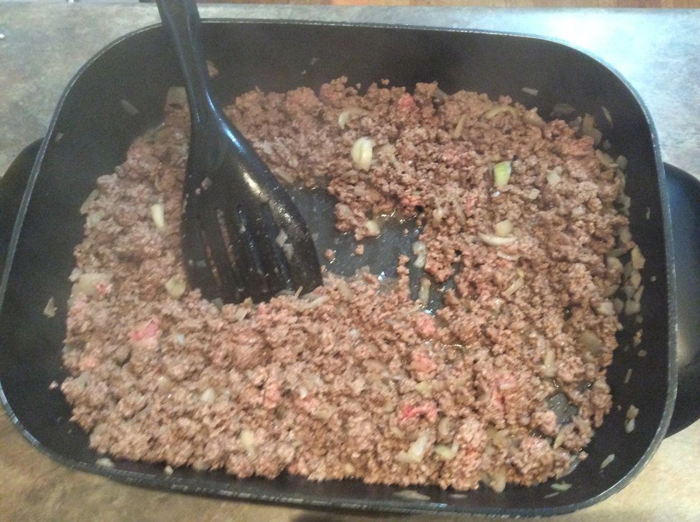 Continue until mince and onion are browned. Return to low heat.