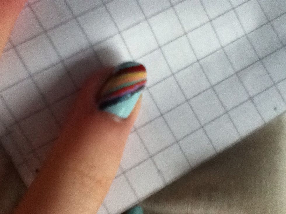 Continue until you have completed the rainbow. If the bottom line is messy then use the base colour to neaten it.