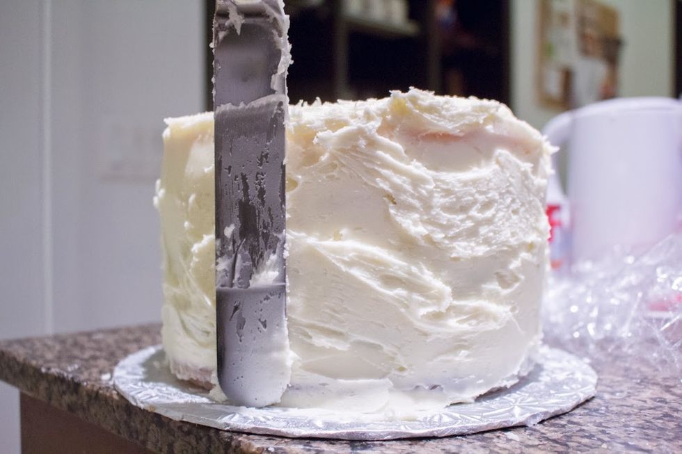 Continue using a cake spatula. For more details on how to ice a multi-layer cake: http://annezca.blogspot.ca/2014/12/how-to-ice-multi-layer-cake.html
