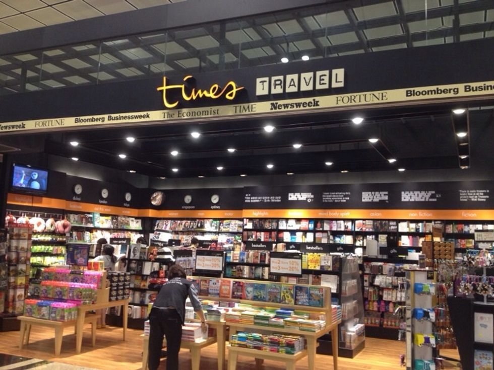 Continue walking and you will find the Times bookstore on your right while opposite on your left is ATM machines and the toilet