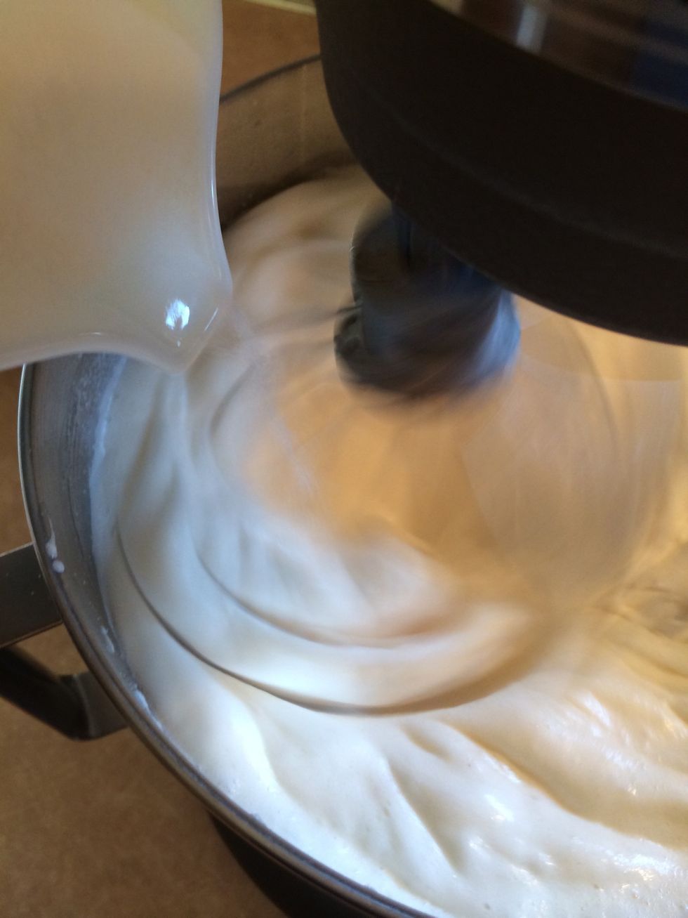 Continue whipping egg whites. Gradually add remaining sugar or gradually add by tablespoon one at a time.