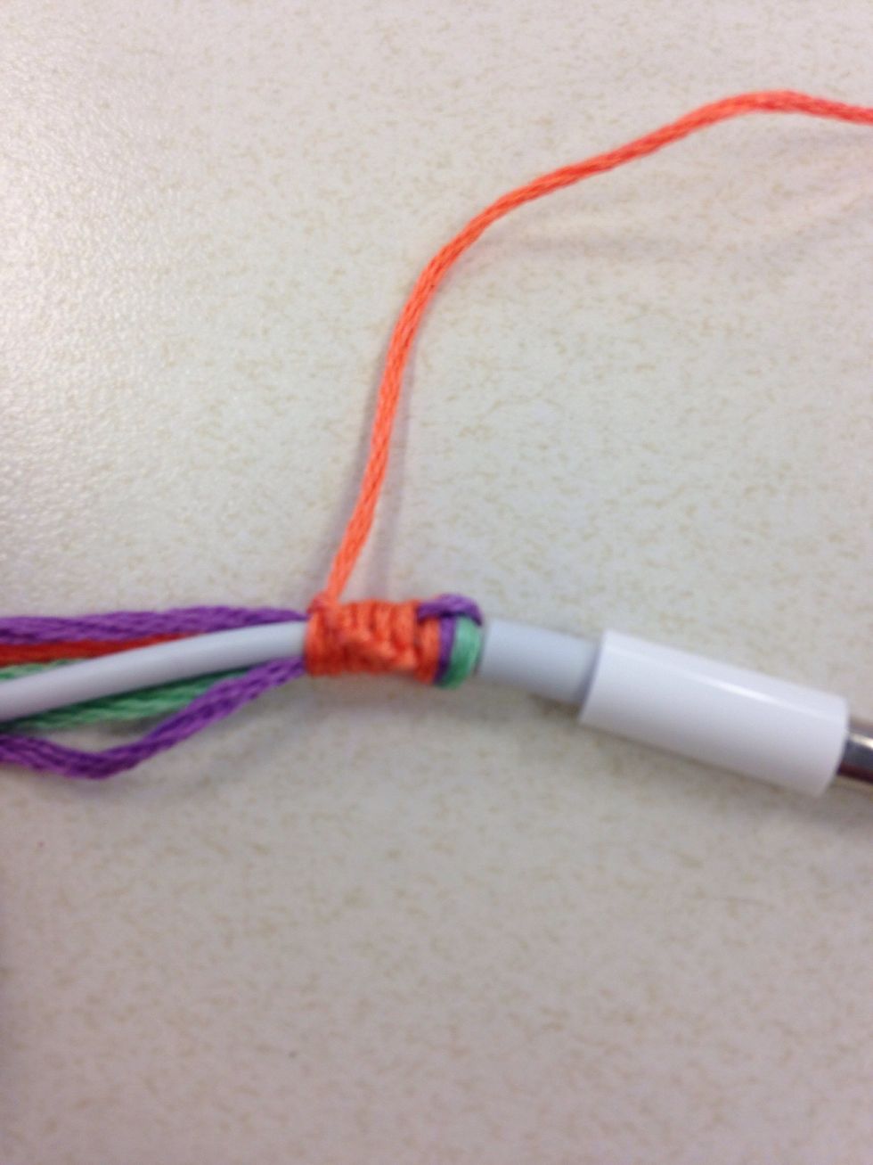Continue with the same strand to make knots, you'll notice the small knots creating a spirally design and it's covering up the loose strands.
